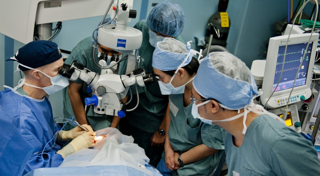 MANADO, INDONESIA (June 1, 2012) Cmdr. Brice Nicholson performs cataract surgery on an Indonesian patient as Indonesian optometry residents observe in an operating room aboard the Military Sealift Command hospital ship USNS Mercy (T-AH 19) during Pacific Partnership 2012. Now in its seventh year, Pacific Partnership is an annual U.S. Pacific Fleet humanitarian and civic assistance mission that brings together U.S. military personnel, host and partner nations, non-government organizations and international agencies to build stronger relationships and develop disaster response capabilities throughout the Asia-Pacific region. (U.S. Navy photo by Mass Communication Specialist 3rd Class Michael Feddersen/Released) 120601-N-GL340-085 Join the conversation http://www.facebook.com/USNavy http://www.twitter.com/USNavy http://navylive.dodlive.mil